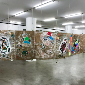 Installation view. <i>Modern Untitled Tragic Timeline</i>, 2019. Collage: acrylic paint, cash, grocery bags on paper, acrylic tubes and twine. 45 x 720 in./ 114.3 x 1828.8 cm.