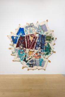 <i>Red Triangle Geometric Quilt</i>, 2007. Oil and clothes on canvas with stretcher bars, 104 × 101 inches. 