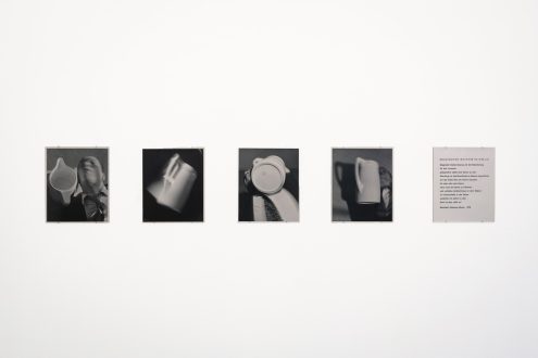 Anna and Bernhard Blume
<i>Magischer Determinismus</i>, 1976
Set of four b/w photographs and printed text
14 x 11.75 in. each
(photo: Fernando Sandoval/MW)<br>
<p>Magic Determinism, is a 1974 photo sequence by the German artist couple Anna and Bernhard Blume (1936-2020 and 1937-2011). A human being and an object - a jug - are brought not only into a formal but also puzzling interrelation between the human's and object's consciousness. Though not widely known in the US, throughout the years, the Blumes' work has been the subject of many and major institutional exhibitions (such as a 1989 MoMA Project or solo show at the Kunsthalle Basel in 1987).</p>
<p>Translated from German, the text reads:
"Magic Determinism is the term for the situation of occasionally being a jug.
However, in that moment one's consciousness is reduced to that of being the jug. I would therefore be a jug without recognizing myself as such and would furthermore remain under the illusion - unlike the jug - to remain myself. But this is not like that.
Bernhard Johannes Blume, 1976"</p>